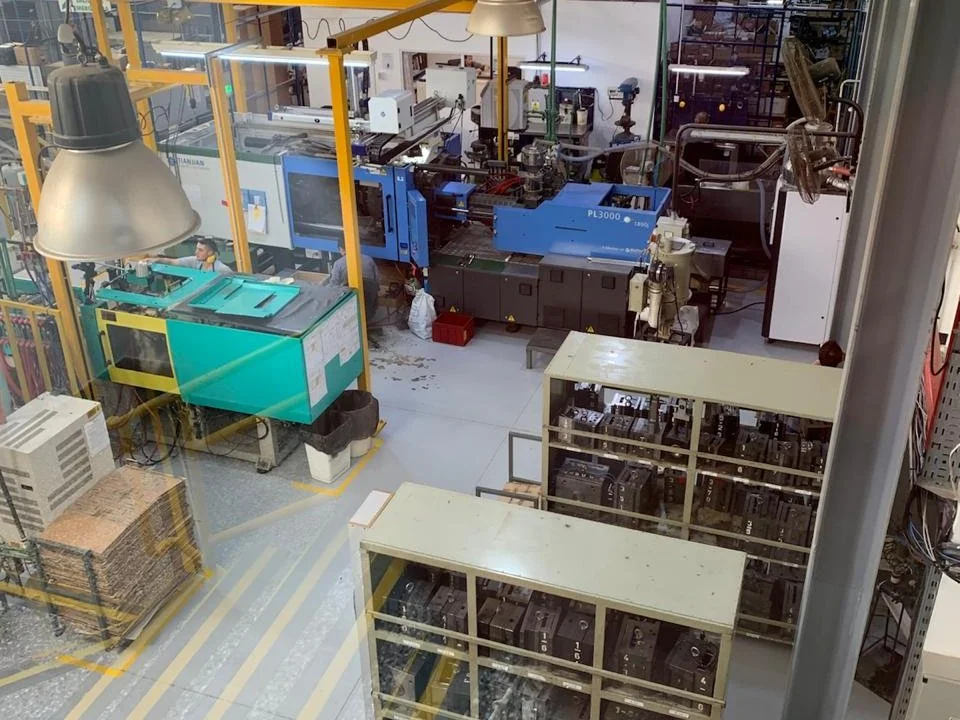Industrial plant floor with rows of production machinery