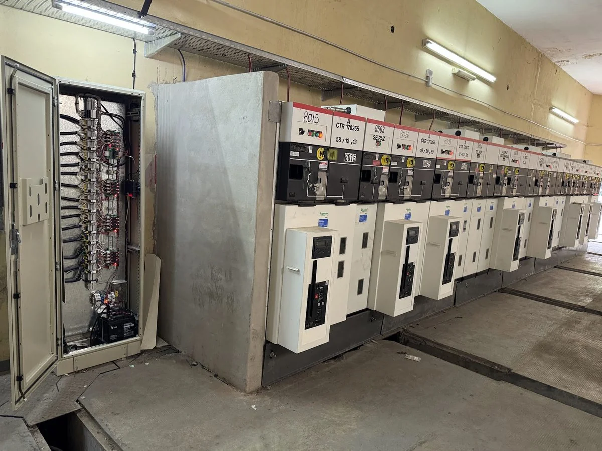 Medium-voltage switchgear room in a substation, with an open control cabinet