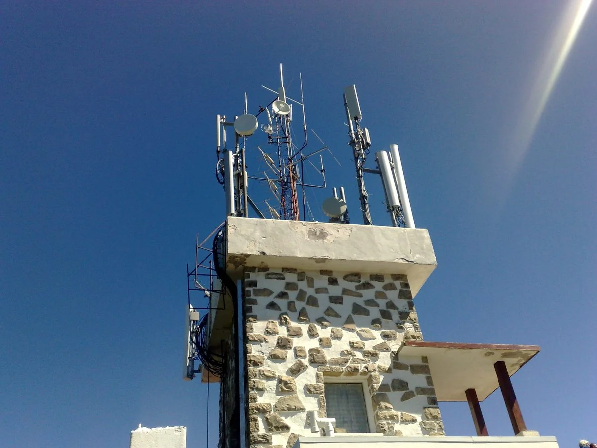 Telecommunications tower with cellular and microwave antennas