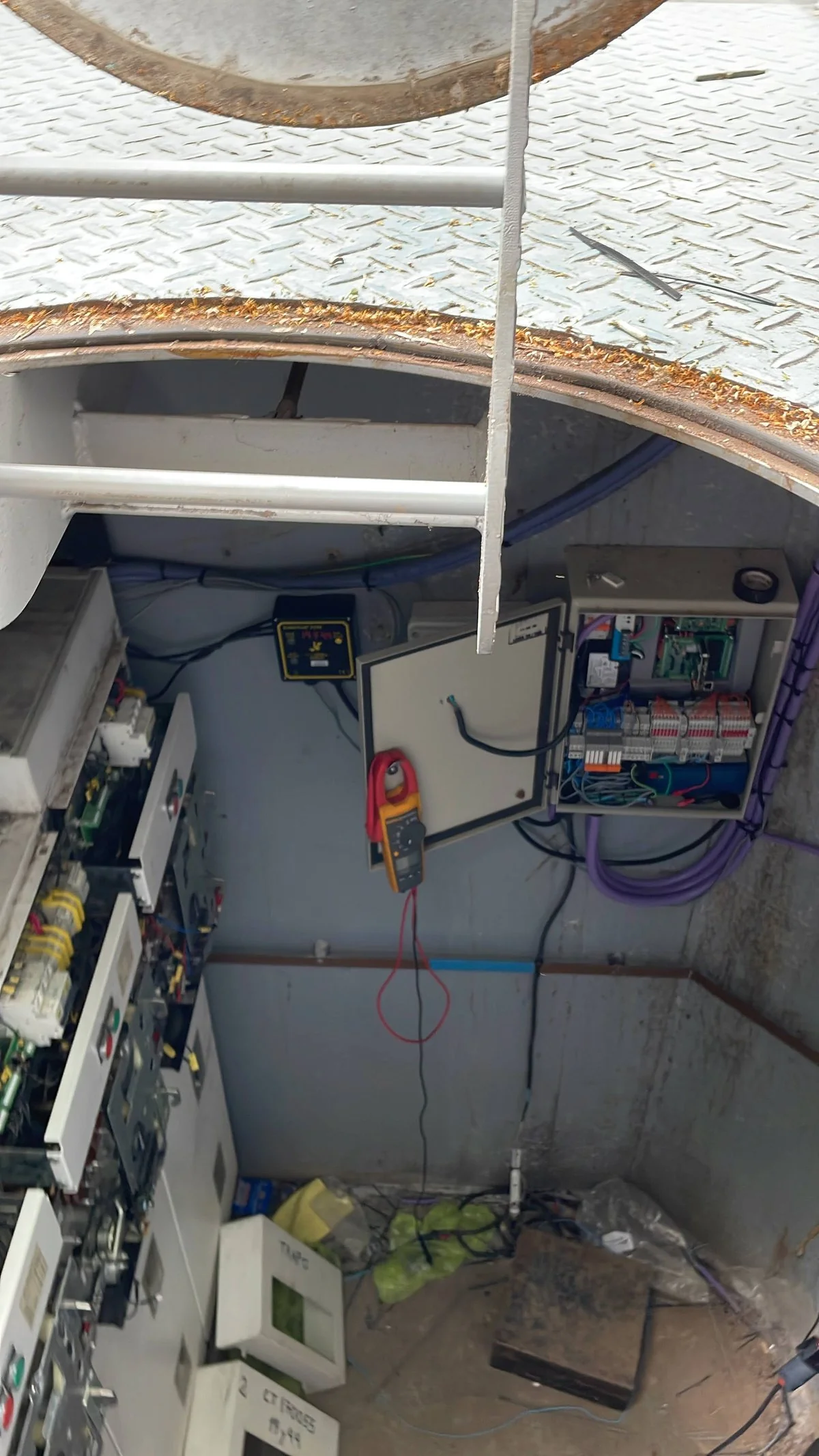 Control panel installed inside an underground medium-voltage vault, seen from the access hatch