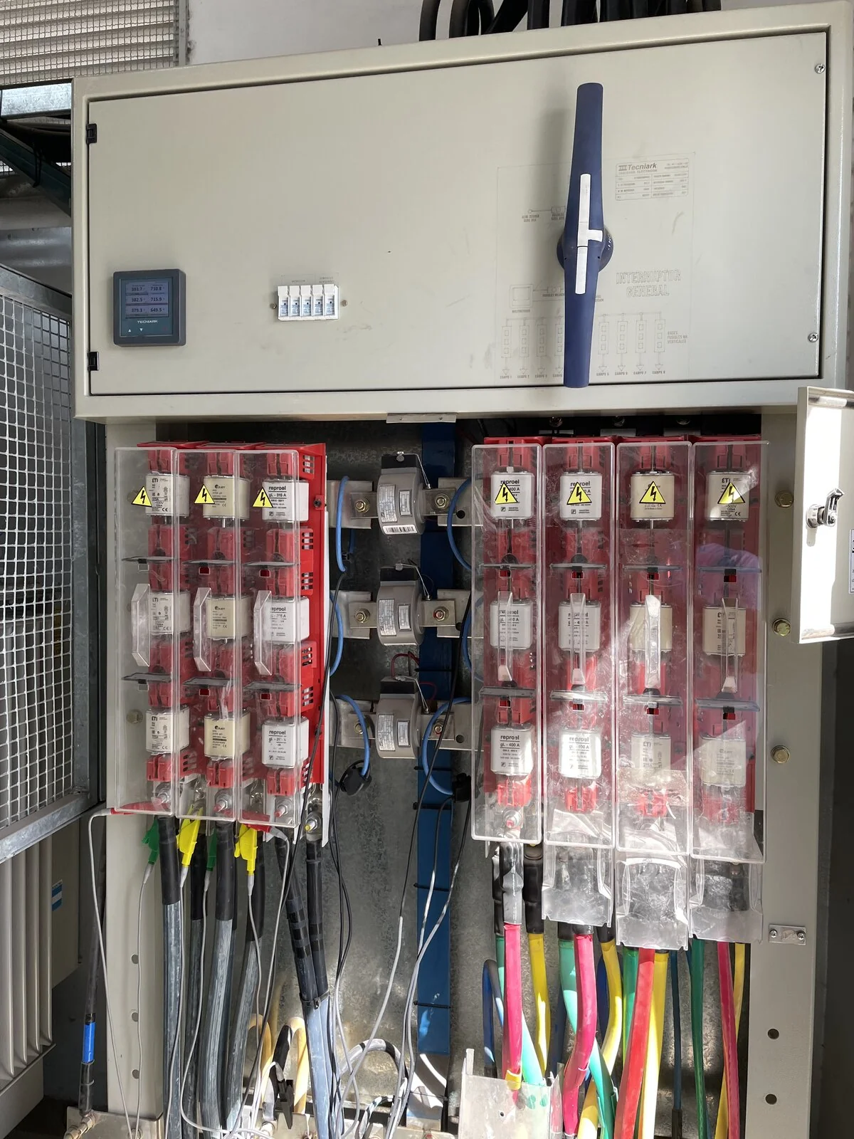 Low-voltage panel with fuse bases and outgoing wiring